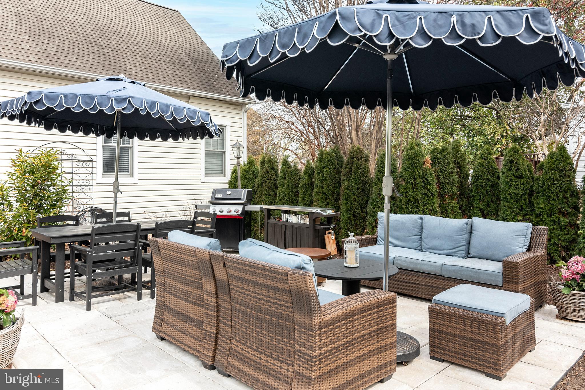 205 Cherry Street St. Michaels, MD 21663 - Photo 59 of 64 a view of a patio with couches under an umbrella
