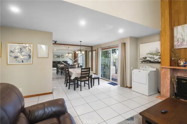 a view of a dining room with furniture and a livingroom
