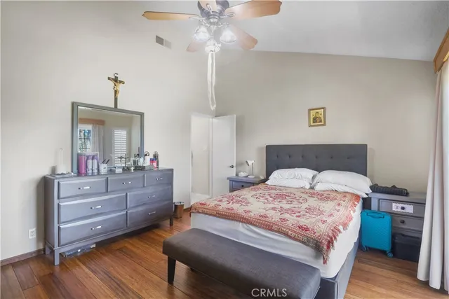 a bedroom with a bed and a mirror