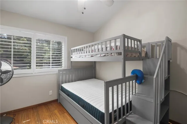 a bedroom with furniture and a window