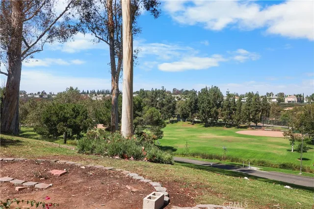 a view of a golf course with a big yard
