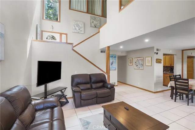 a living room with furniture ceiling fan and a rug
