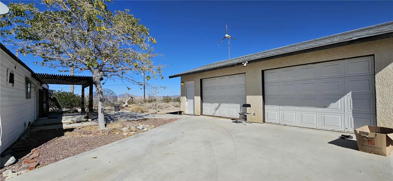 7535 Camp Rock Road Lucerne Valley, CA 92356 - Photo 19 of 62 a view of a house with a patio