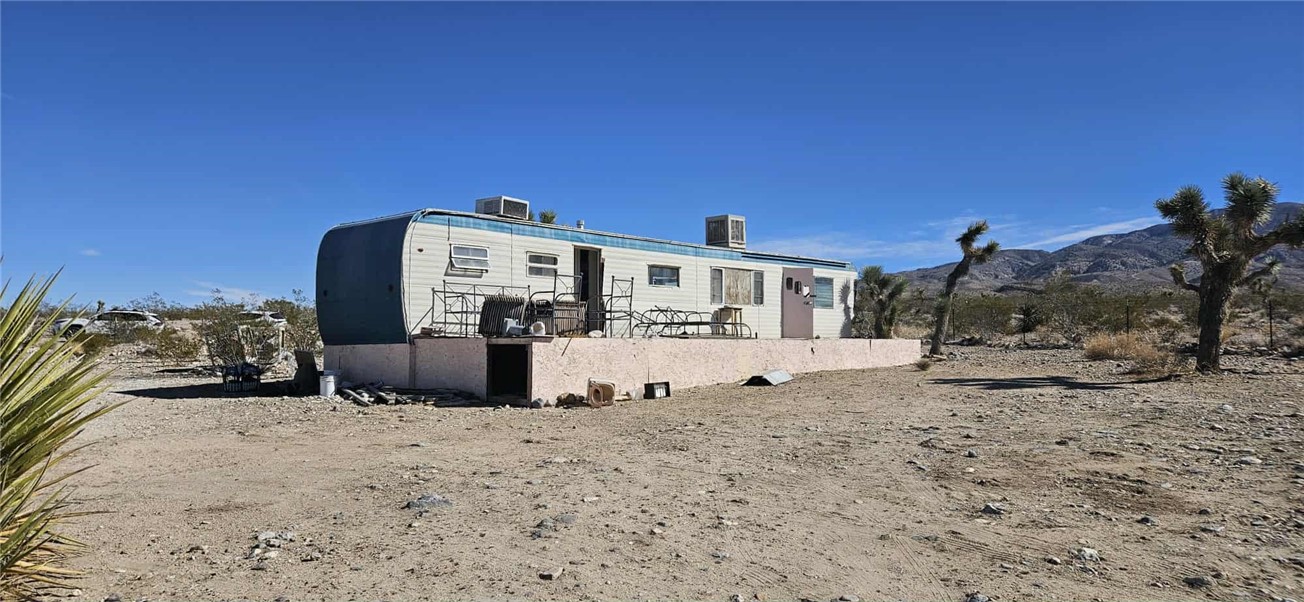 7535 Camp Rock Road Lucerne Valley, CA 92356 - Photo 34 of 62 a view of a house with a snow in the background