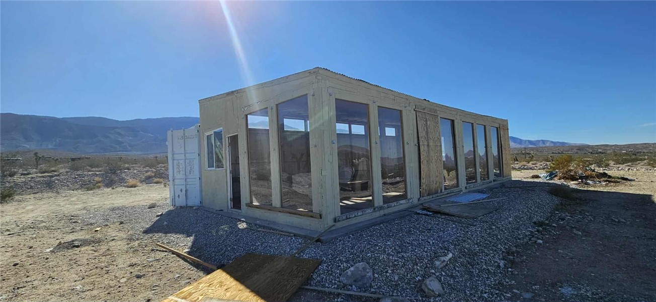 7535 Camp Rock Road Lucerne Valley, CA 92356 - Photo 47 of 62 a view of a house with a yard