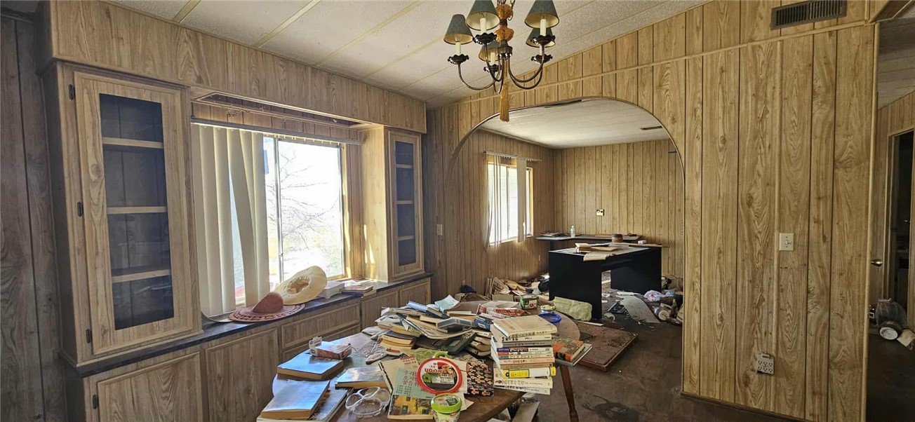 7535 Camp Rock Road Lucerne Valley, CA 92356 - Photo 8 of 62 a bedroom with a bed and a chandelier