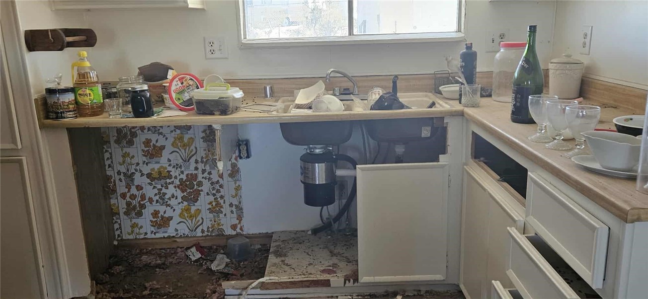 7535 Camp Rock Road Lucerne Valley, CA 92356 - Photo 10 of 62 a kitchen with a granite countertop sink a stove and cabinets