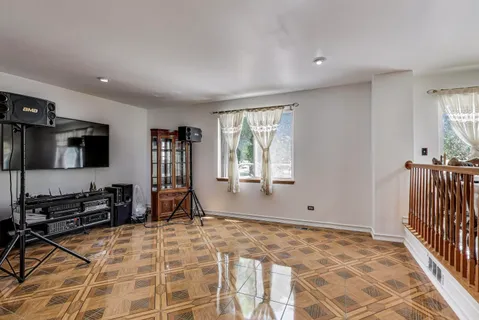 a room with lots of windows and furniture