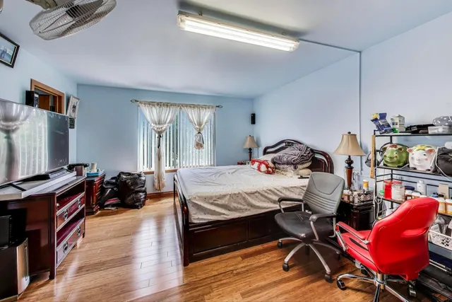 a bedroom with bed and window