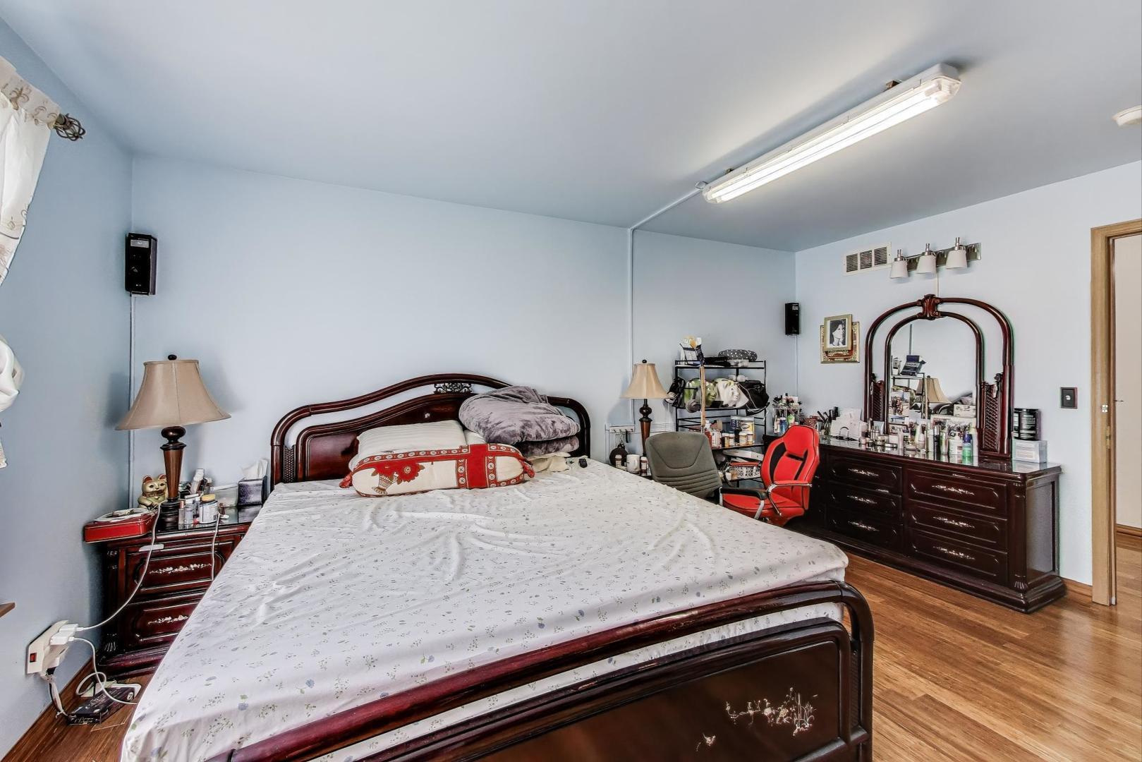 487 Anna Lane Romeoville, IL 60446 - Photo 16 of 38 a bedroom with bed and window