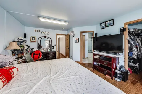 a bathroom with a double vanity sink mirror and toilet