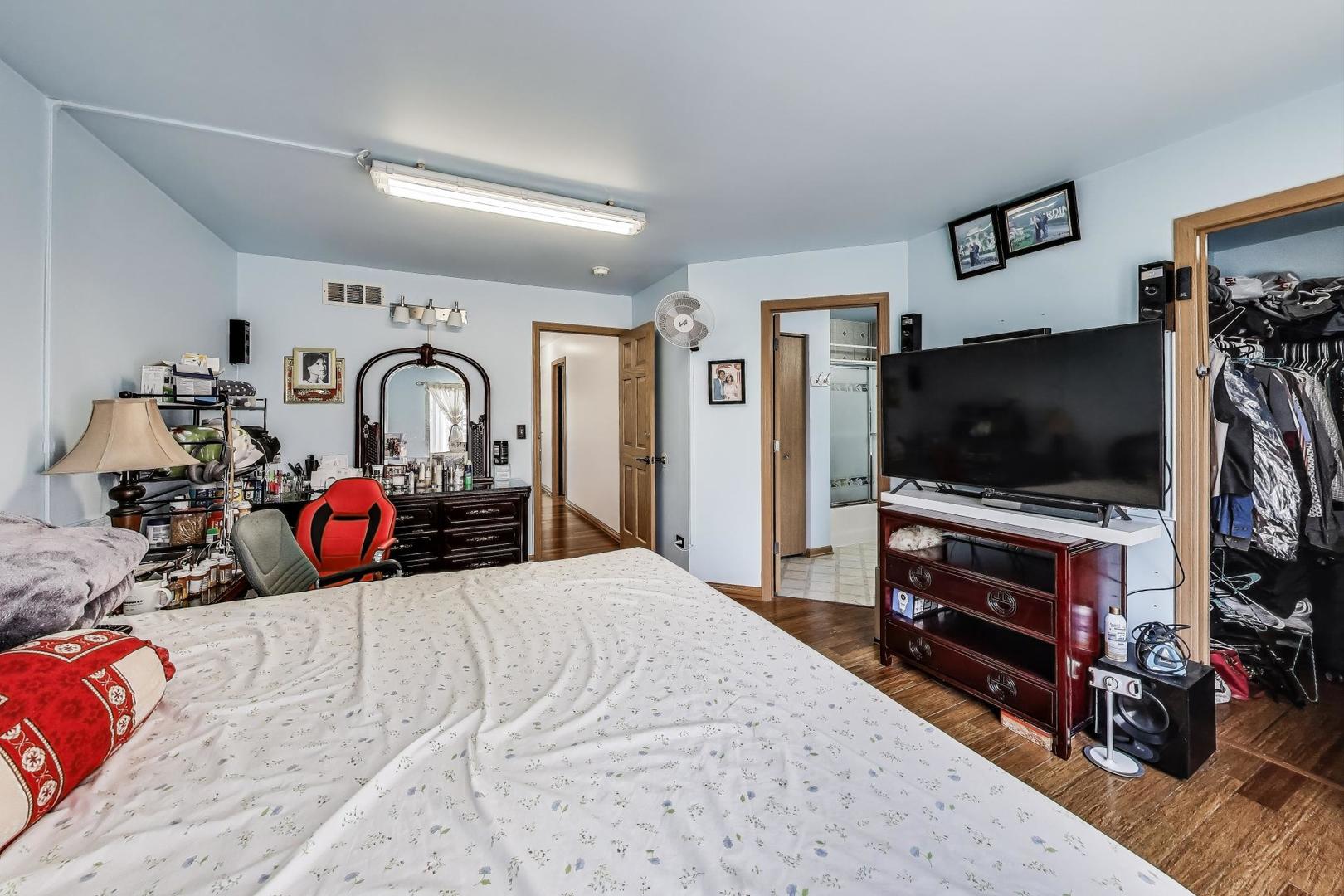 487 Anna Lane Romeoville, IL 60446 - Photo 17 of 38 a bedroom with bed and flat screen tv