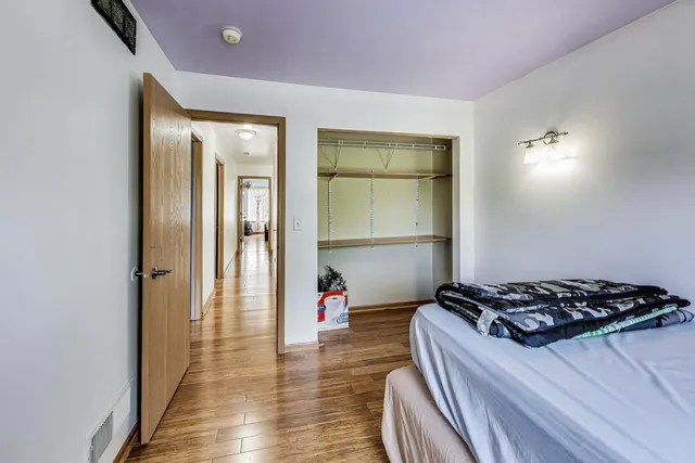 a view of a room with wooden floor