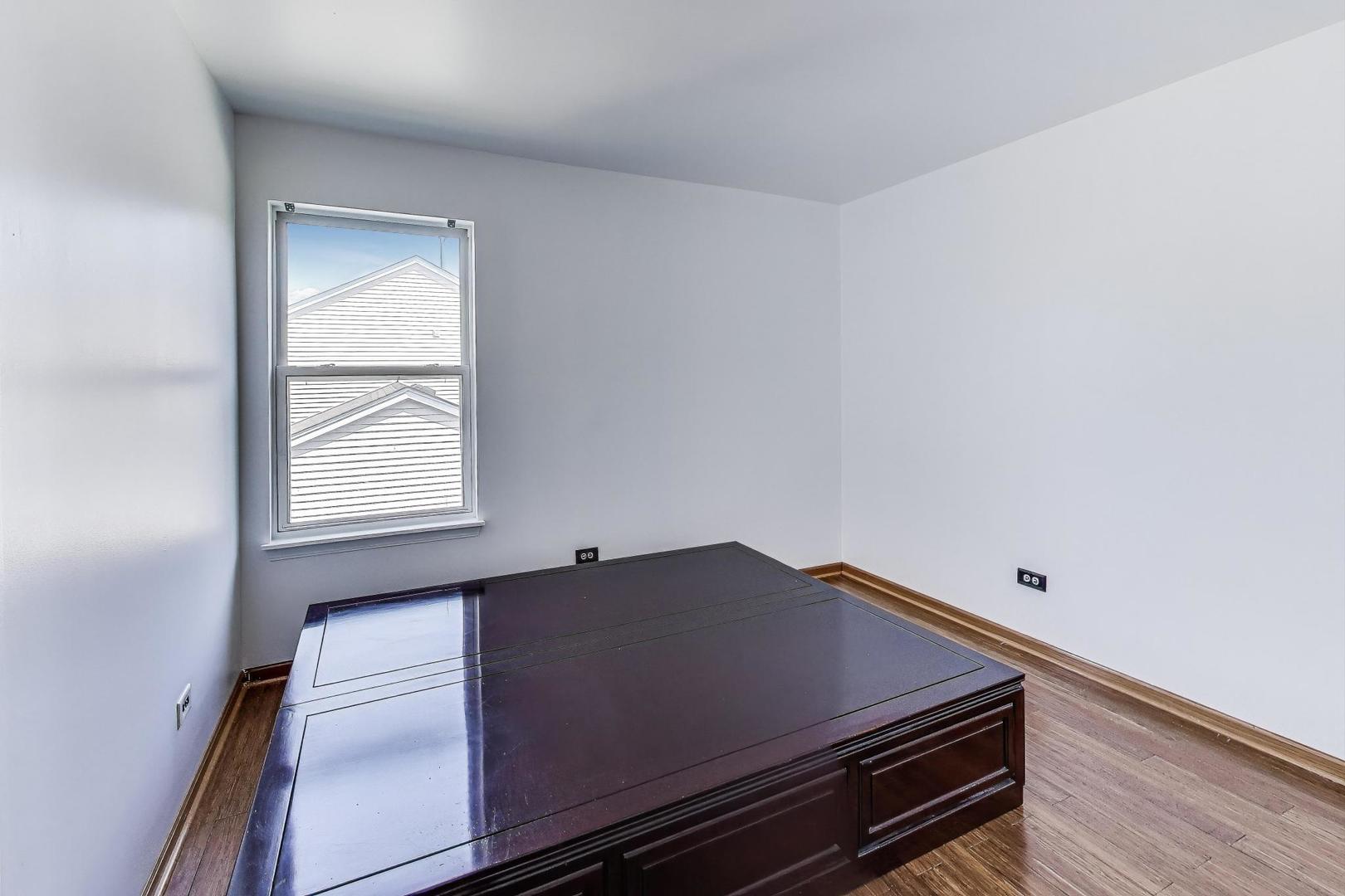 487 Anna Lane Romeoville, IL 60446 - Photo 23 of 38 a view of a room with wooden floor