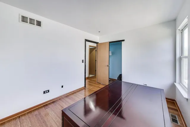 a bathroom with a sink a toilet a mirror and shower