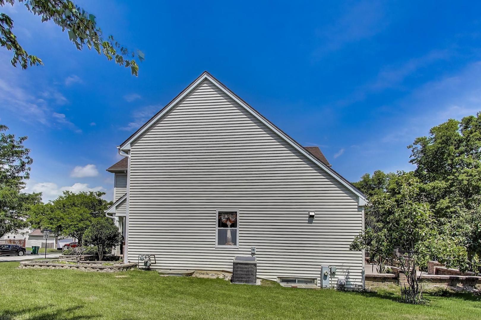 487 Anna Lane Romeoville, IL 60446 - Photo 28 of 38 a view of a house with a yard