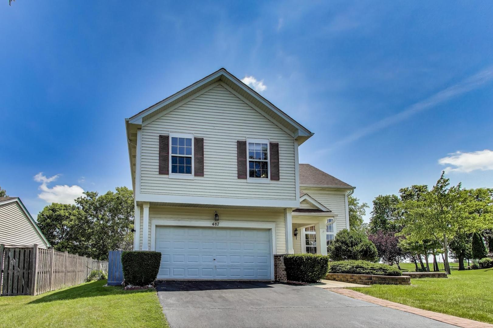 487 Anna Lane Romeoville, IL 60446 - Photo 3 of 38 a front view of a house with a yard and garage