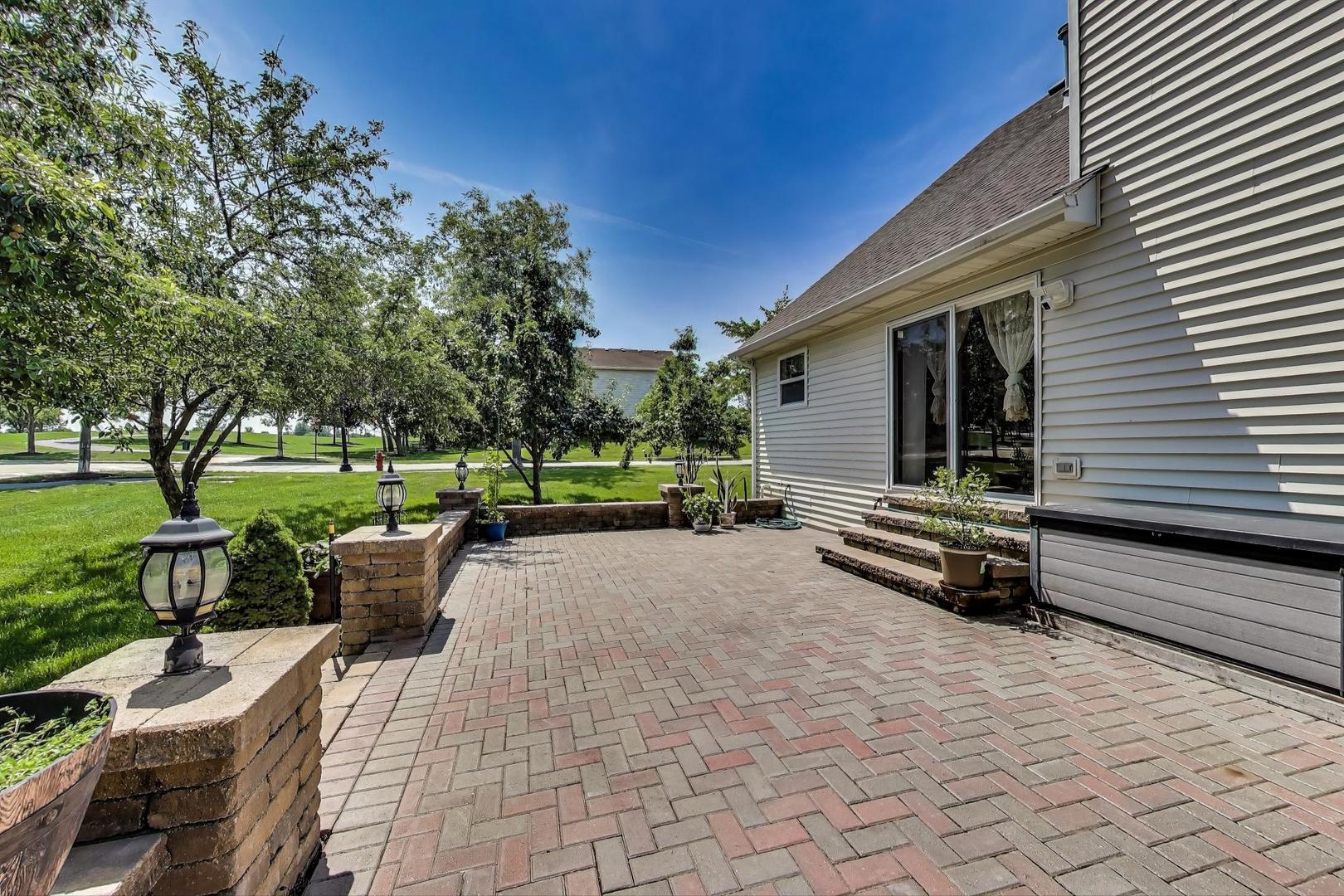 487 Anna Lane Romeoville, IL 60446 - Photo 33 of 38 a view of a house with backyard and sitting area