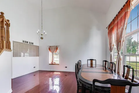 a view of a dining room with furniture and window