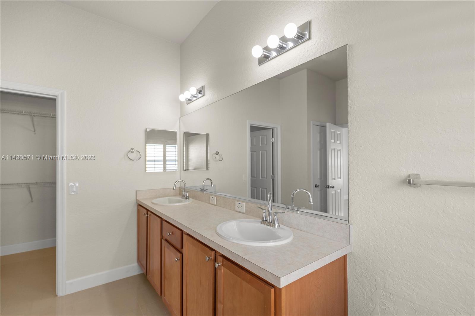 5453 Southwest 40th Street Ocala, FL 34474 - Photo 18 of 40 a bathroom with a sink and a mirror