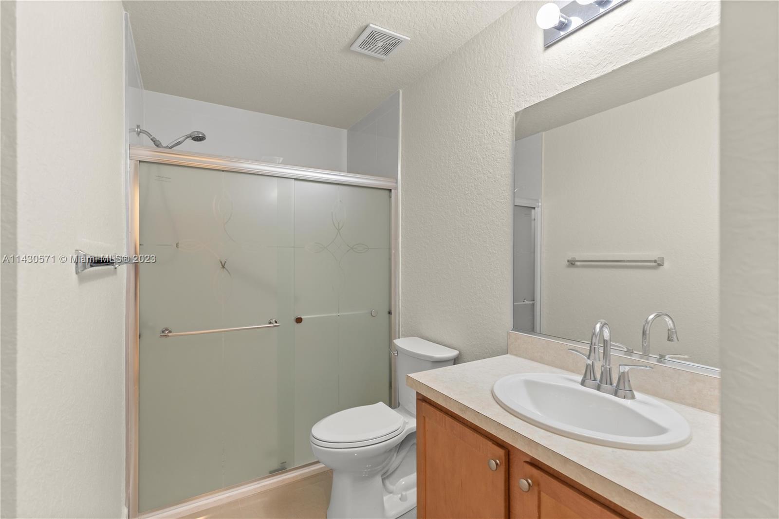 5453 Southwest 40th Street Ocala, FL 34474 - Photo 22 of 40 a bathroom with a sink toilet and shower