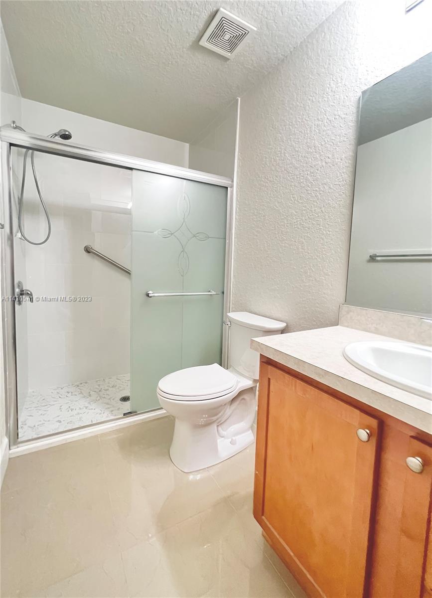 5453 Southwest 40th Street Ocala, FL 34474 - Photo 23 of 40 a bathroom with a toilet and a shower