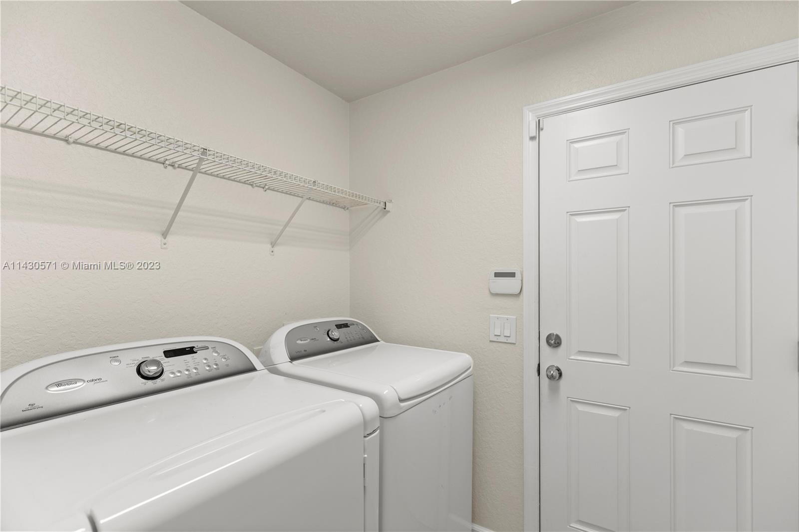 5453 Southwest 40th Street Ocala, FL 34474 - Photo 26 of 40 a utility room with dryer and washer