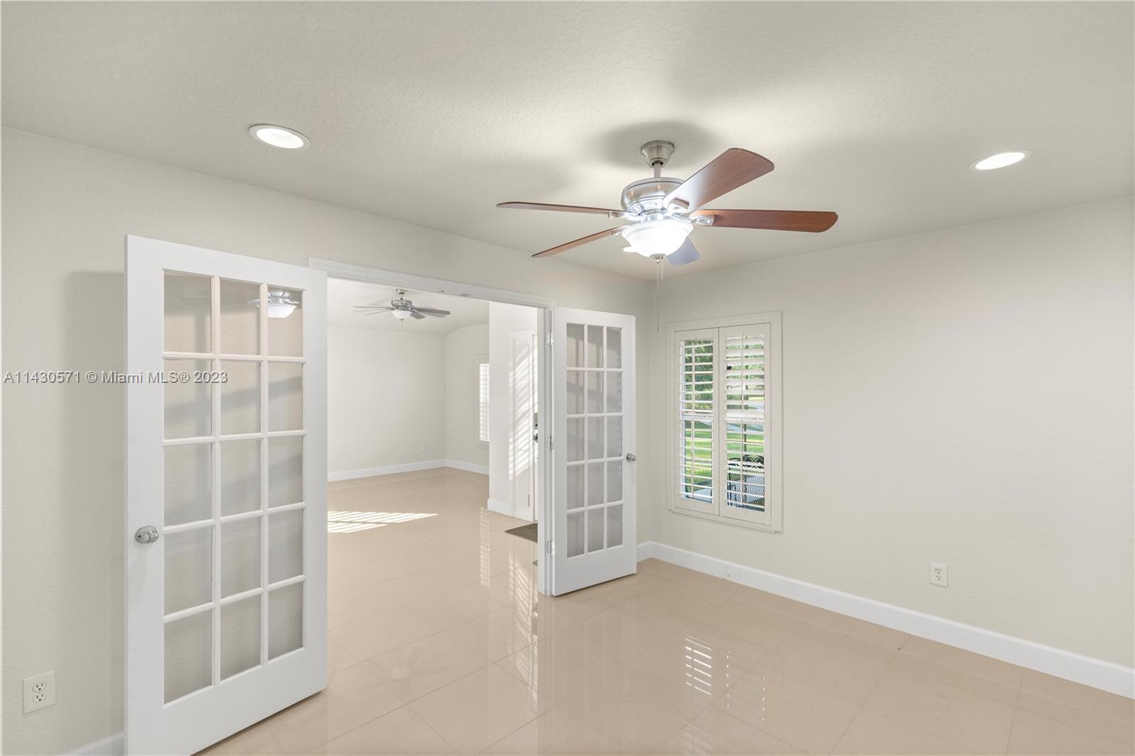 5453 Southwest 40th Street Ocala, FL 34474 - Photo 10 of 40 an empty room with windows and fan