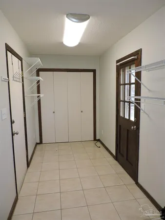 a view of an empty room with entrance