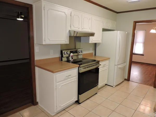 a kitchen with cabinets and appliances