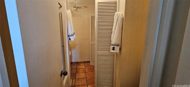 a plant in a garden with a tree