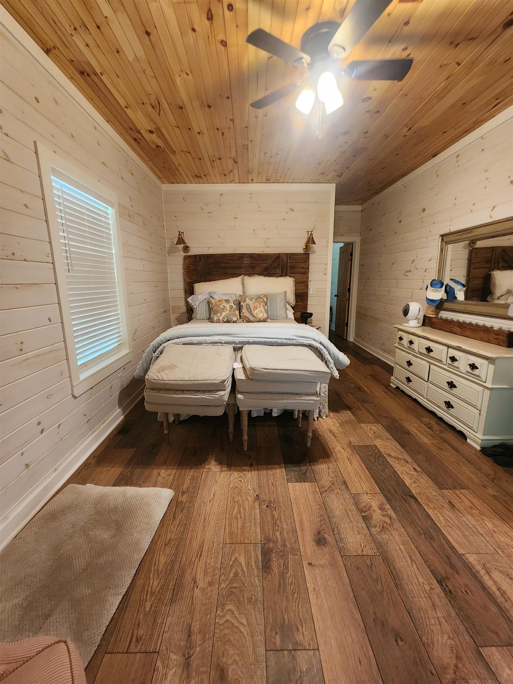 540 Muscatel Lane Counce, TN 38326 - Photo 12 of 35 a spacious bedroom with a bed and a couch