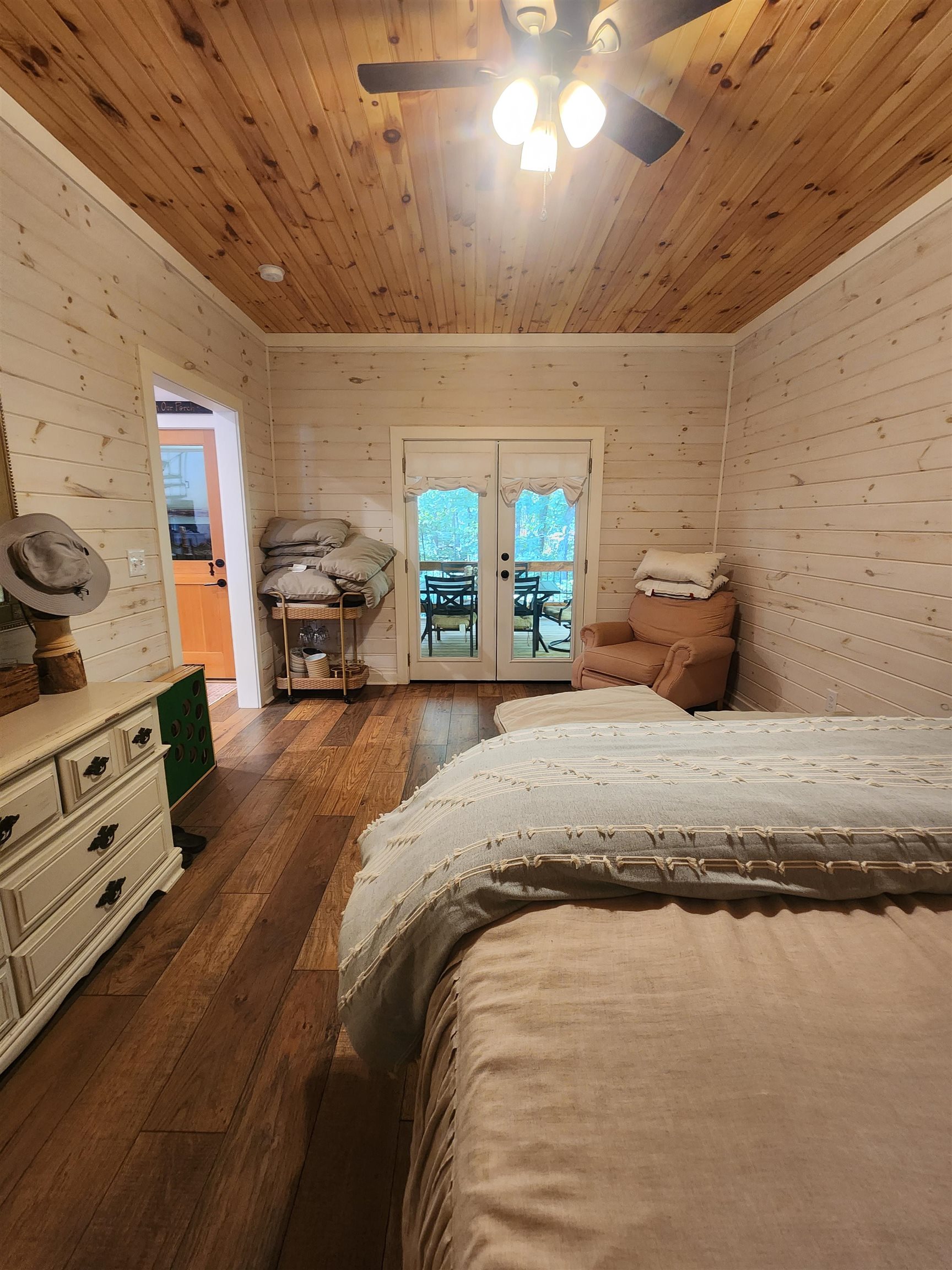 540 Muscatel Lane Counce, TN 38326 - Photo 14 of 35 a bedroom with a bed and a chandelier