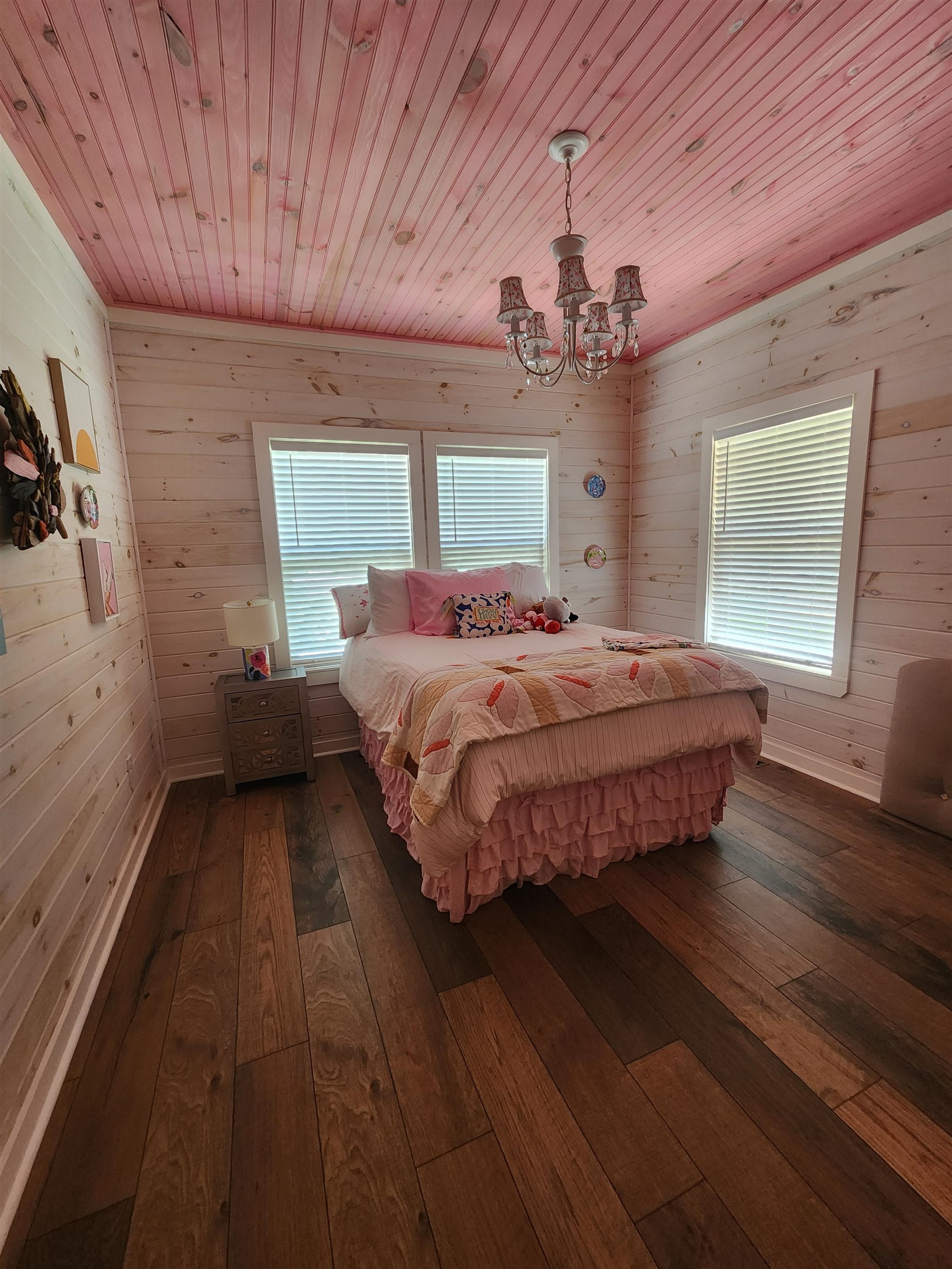 540 Muscatel Lane Counce, TN 38326 - Photo 18 of 35 a bedroom with a large bed chandelier and a window