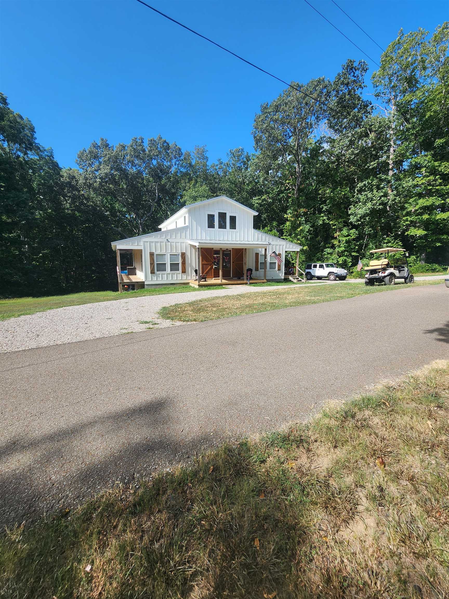 540 Muscatel Lane Counce, TN 38326 - Photo 2 of 35 a front view of a house with a yard and trees