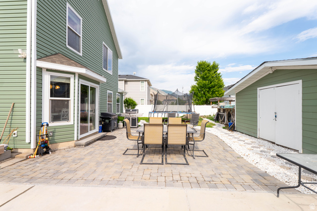 1443 West 250 North Springville, UT 84663 - Photo 22 of 23 Expansive paver patio with a sliding glass door entry
