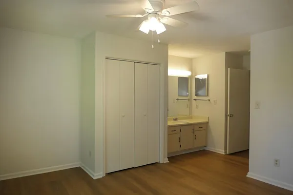 a view of a bathroom with a sink and a mirror
