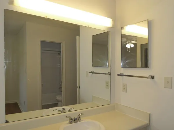 a bathroom with a sink and shower