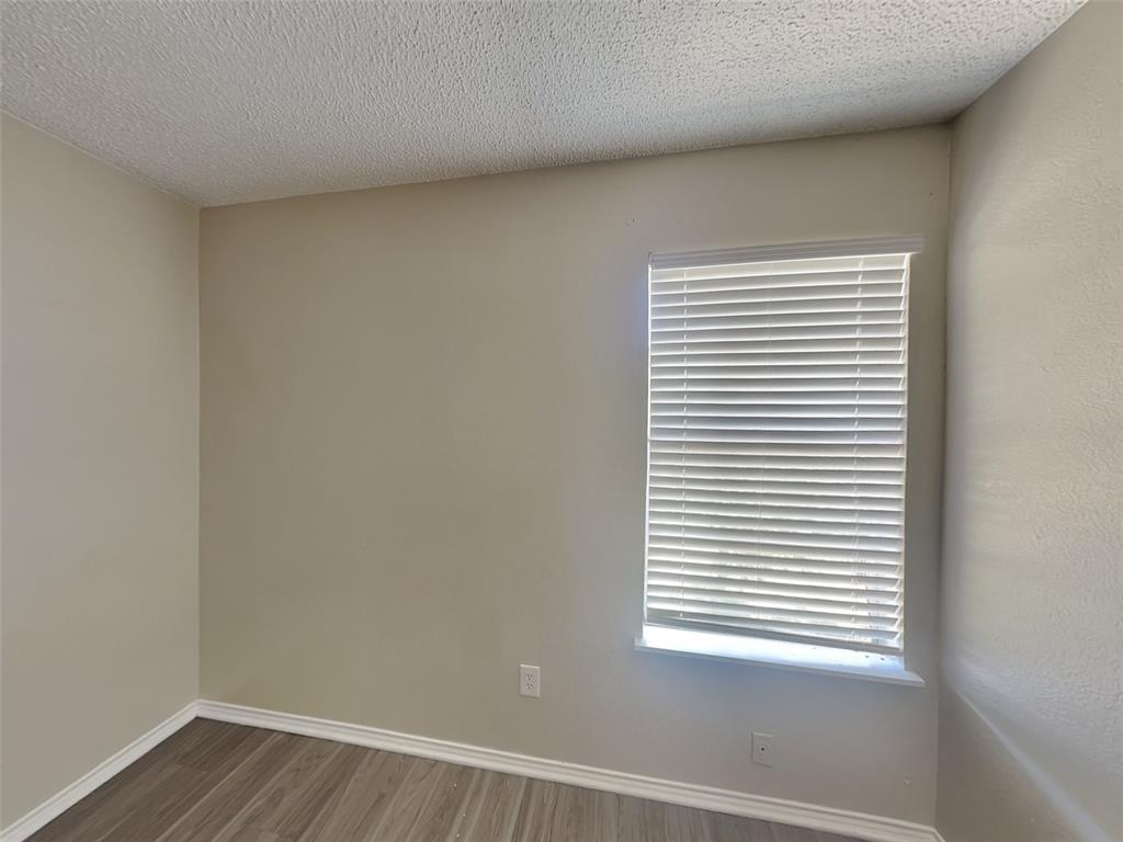 852 Northwest Summercrest Boulevard, Unit B Burleson, TX 76028 - Photo 7 of 13 a view of a small space with a window