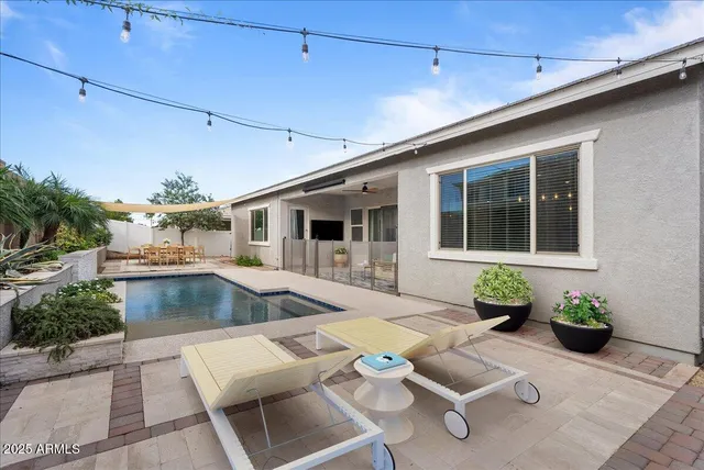 a bedroom with a bed and a painting