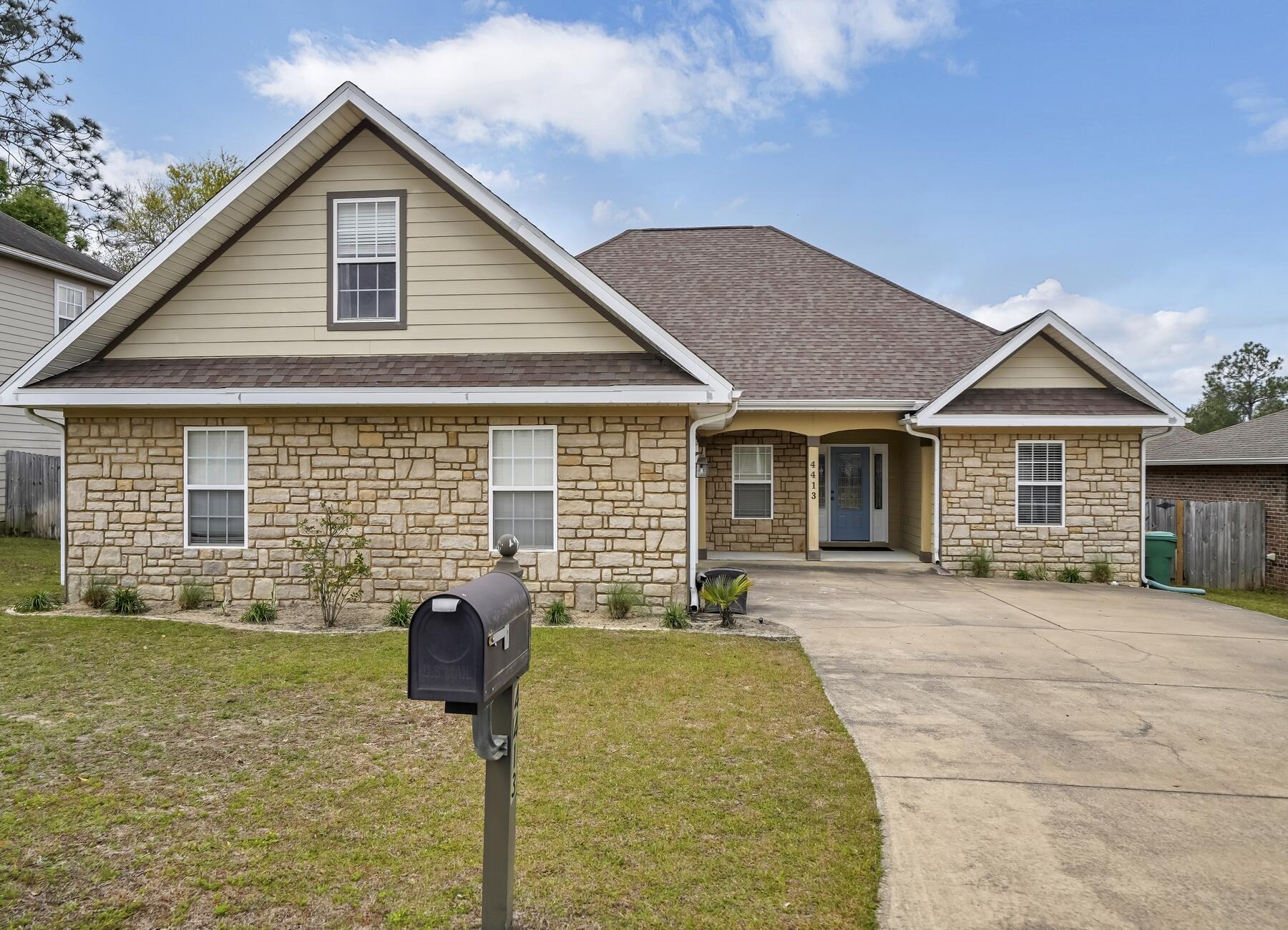 4413 Mirada Way Crestview, FL 32539 - Photo 1 of 30 a front view of a house with patio