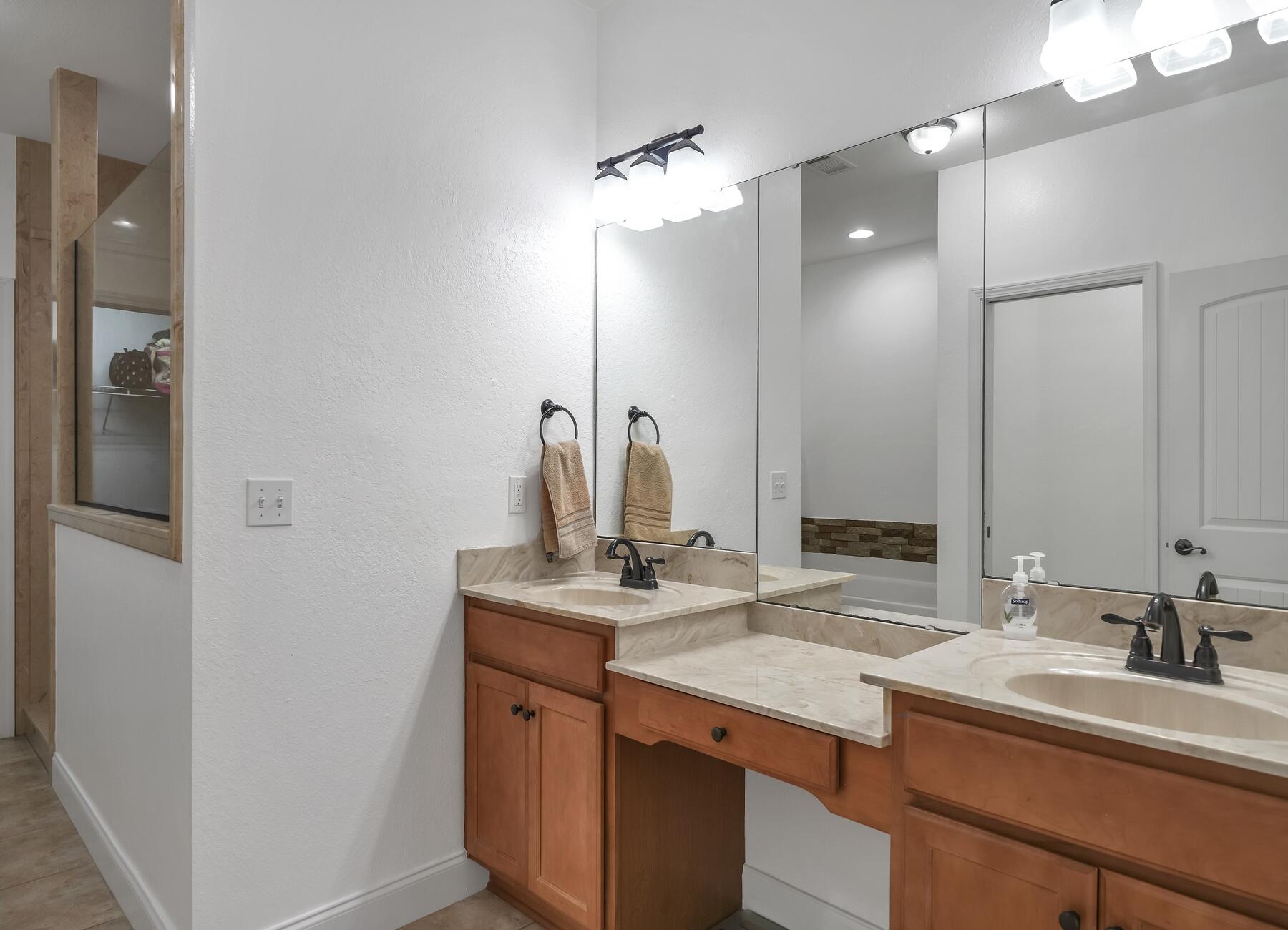 4413 Mirada Way Crestview, FL 32539 - Photo 15 of 30 a bathroom with a sink and a mirror