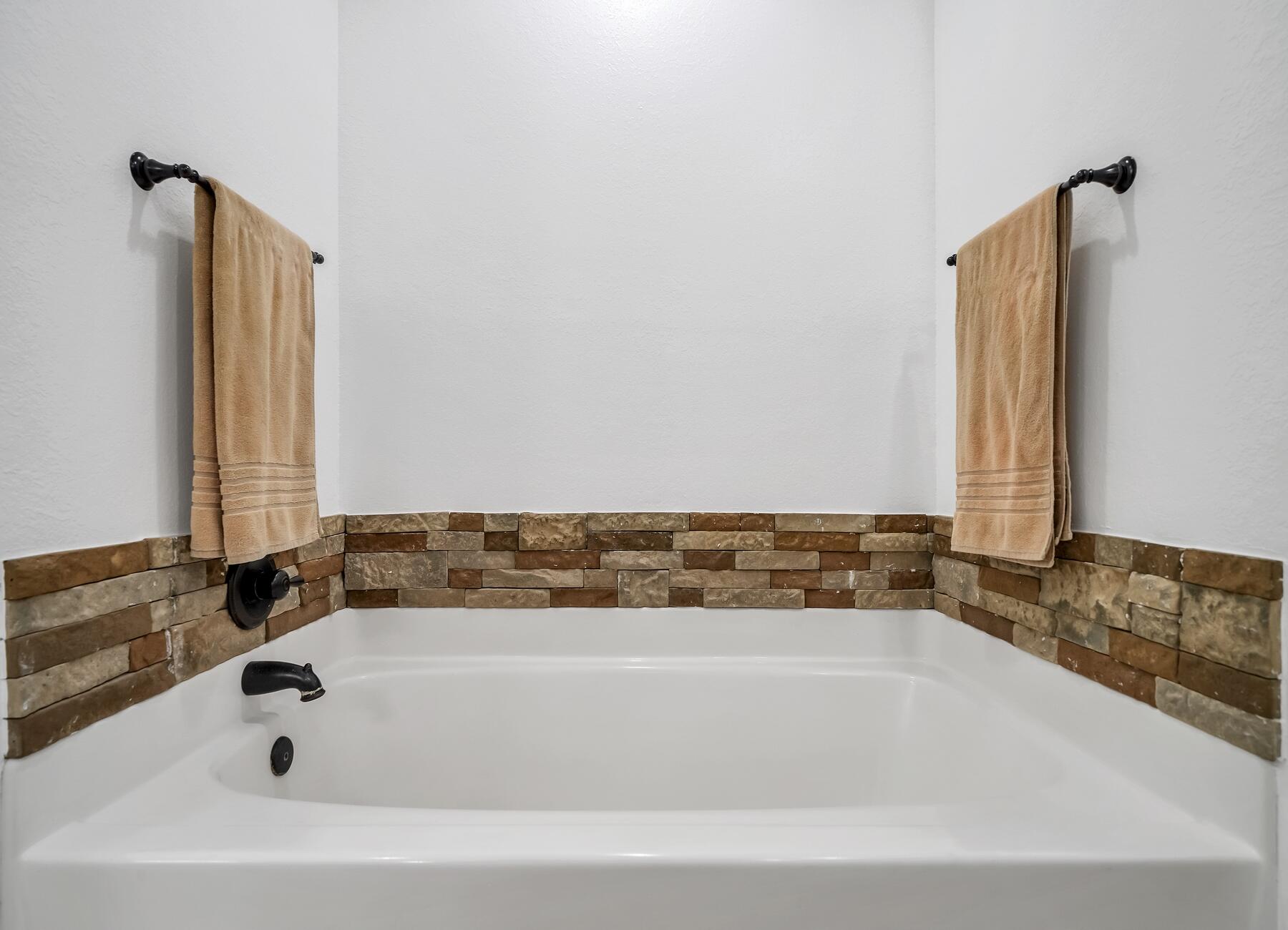 4413 Mirada Way Crestview, FL 32539 - Photo 16 of 30 a bathroom with bathtub and shower