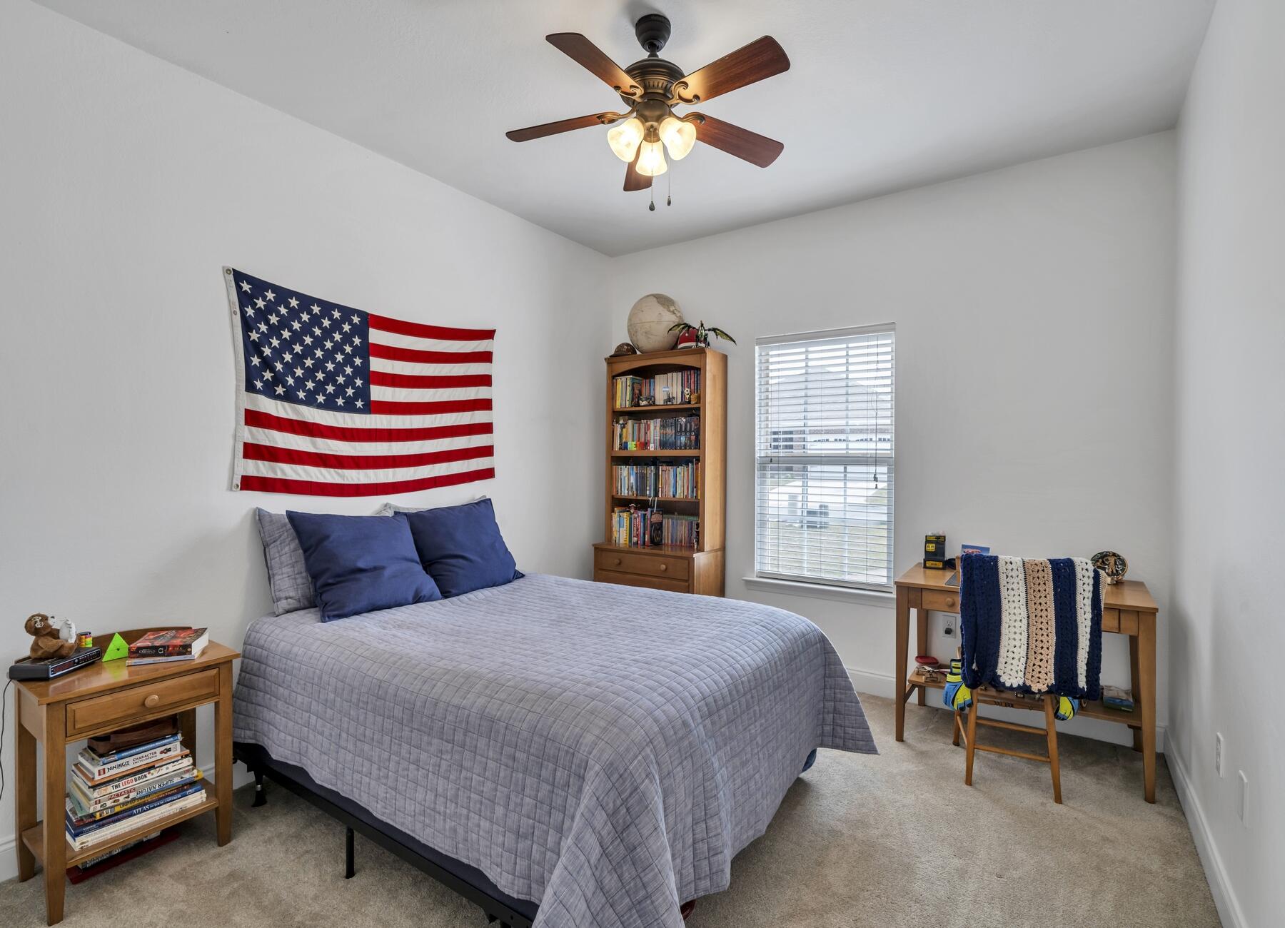 4413 Mirada Way Crestview, FL 32539 - Photo 19 of 30 a bedroom with a bed and a book shelf
