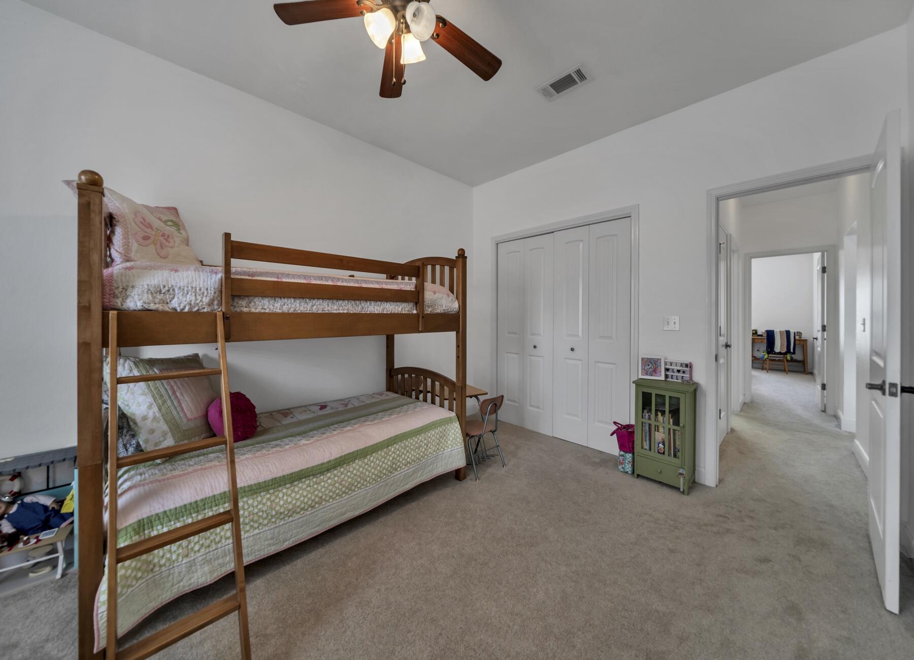 4413 Mirada Way Crestview, FL 32539 - Photo 22 of 30 a bedroom with furniture and a ceiling fan