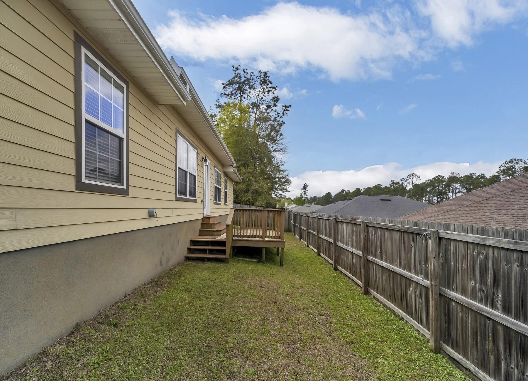 4413 Mirada Way Crestview, FL 32539 - Photo 30 of 30 a view of a house with wooden deck