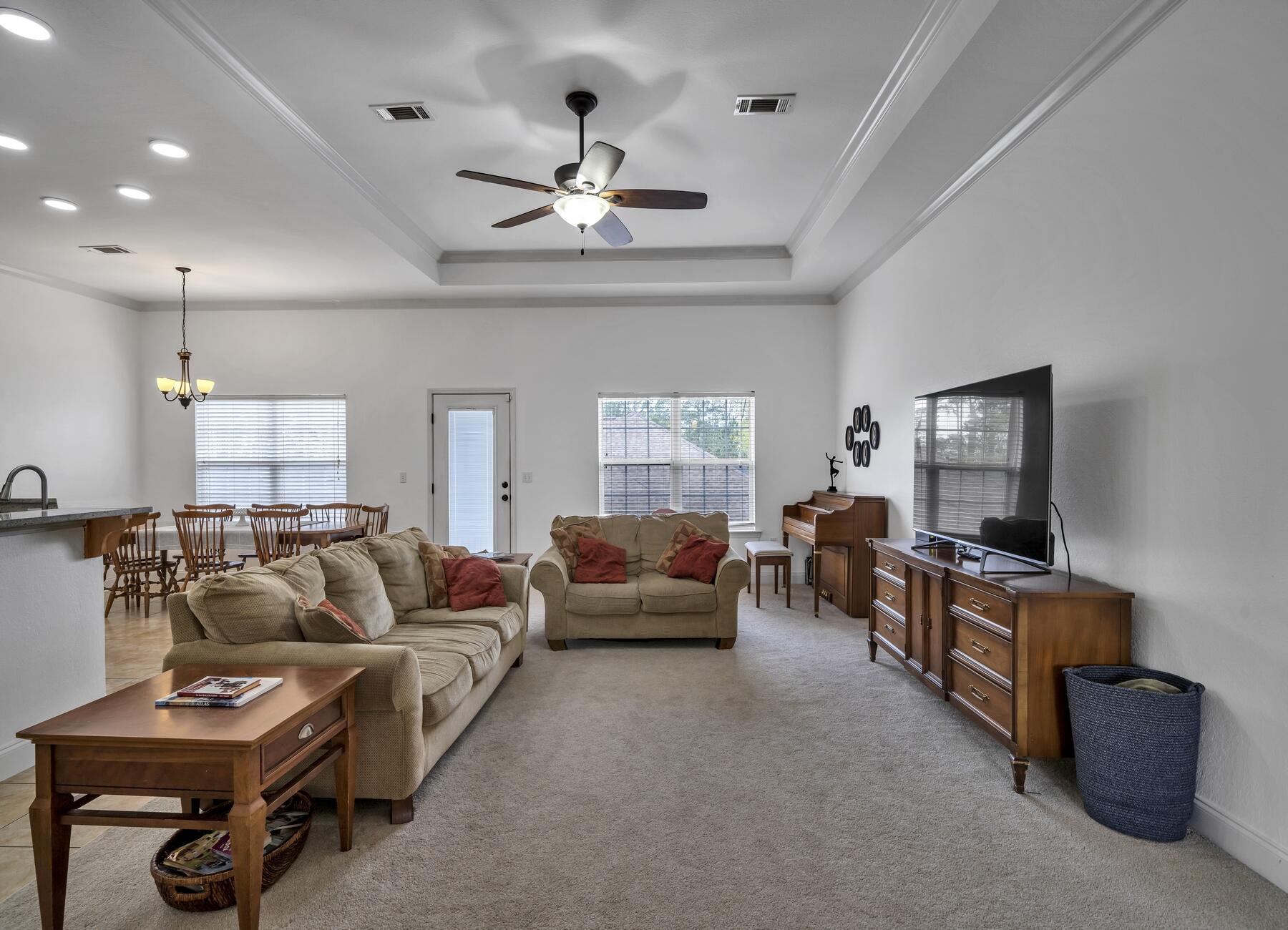 4413 Mirada Way Crestview, FL 32539 - Photo 4 of 30 a living room with furniture and a flat screen tv