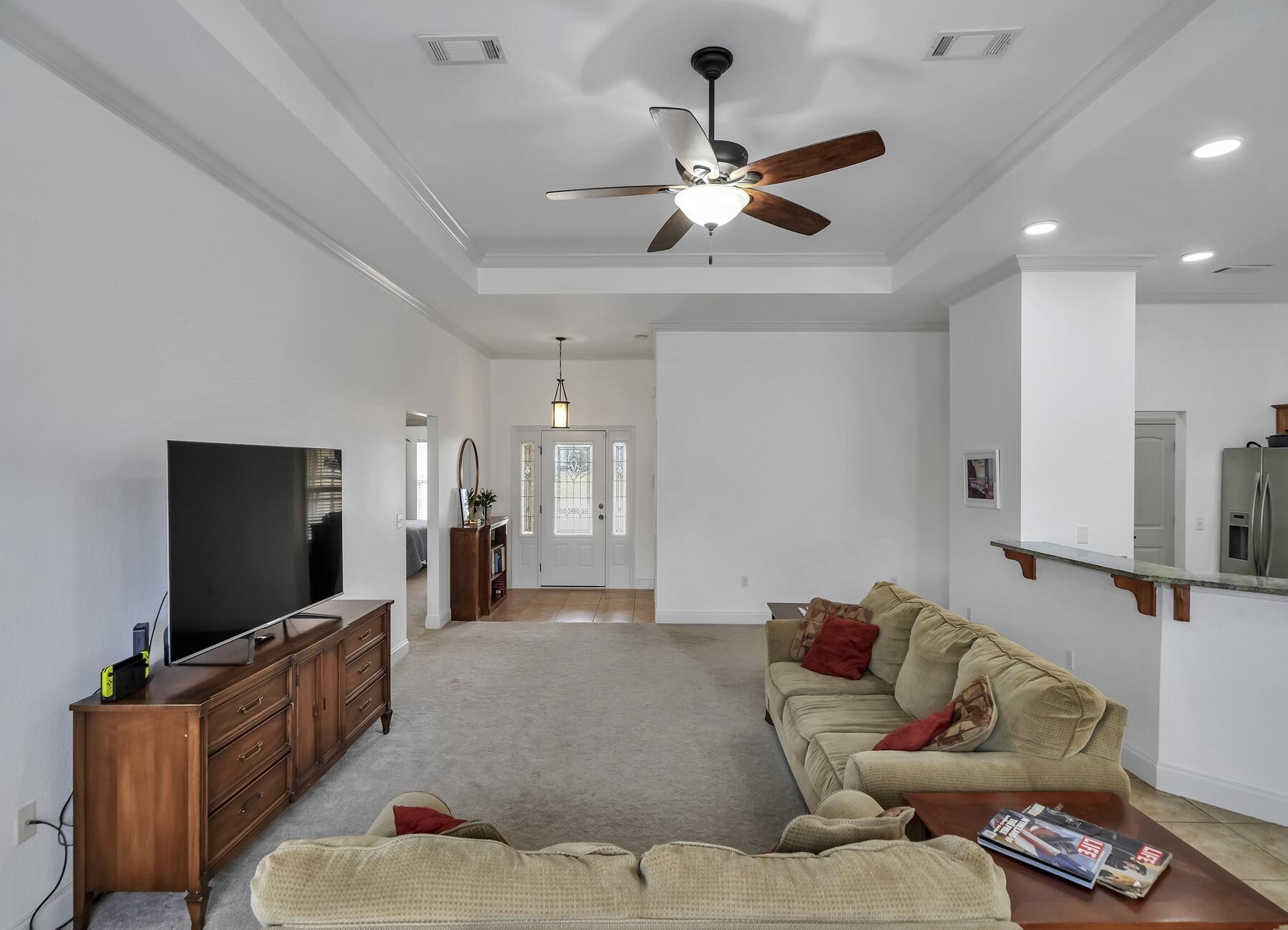 4413 Mirada Way Crestview, FL 32539 - Photo 6 of 30 a living room with furniture and a flat screen tv