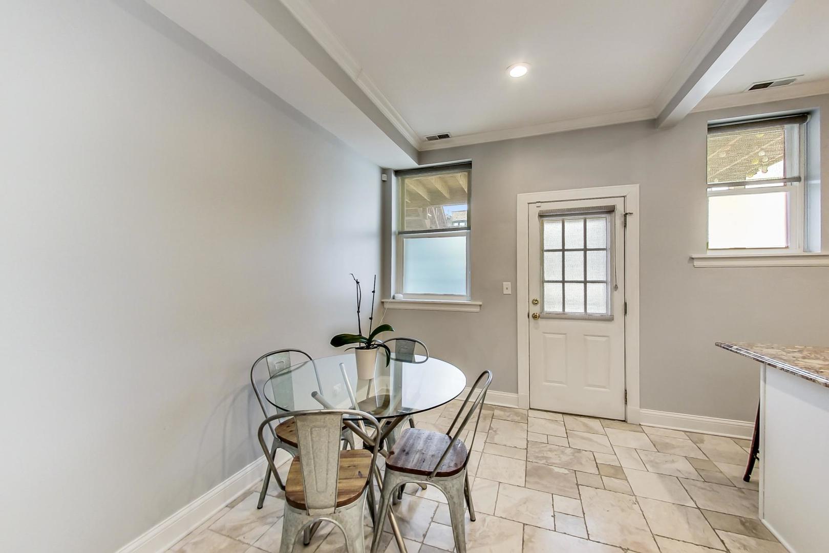 4342 North Sheridan Road, Unit 1N Chicago, IL 60613 - Photo 15 of 29 a table and chairs in a room