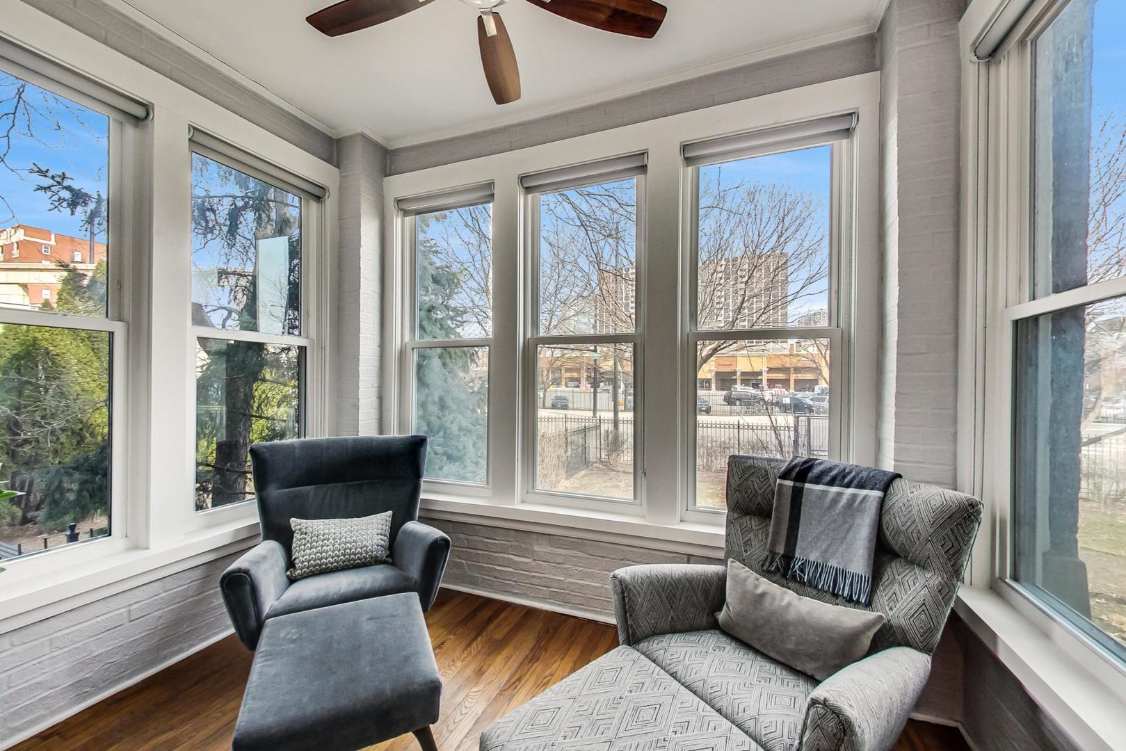 4342 North Sheridan Road, Unit 1N Chicago, IL 60613 - Photo 7 of 29 a living room with furniture and a large window